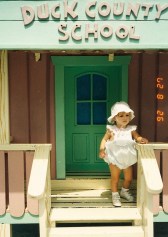 One year old girl in front of small house at Walt Disney World