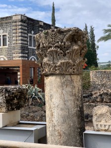 ancient column with carving of menorah on capital