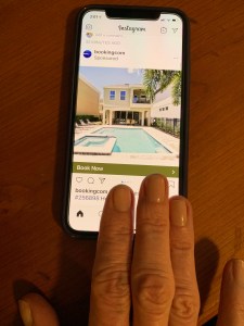 Woman's fingertips on iphone opened to Instagram