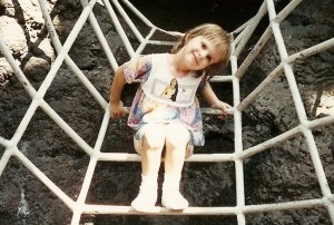 little girl on climbing bars at playground