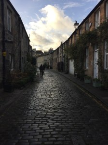Curved street of cobblestone with quaint homes