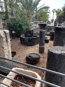 Olive press made of black stone along with some columns