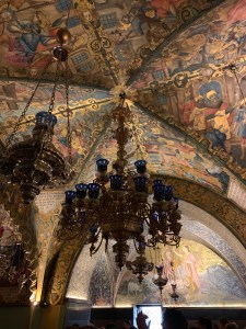 Ornate ceiling painted with scenes from the Bible on the vaulted ceiling of a chapel