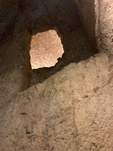 opening into a dungeon carved into rock