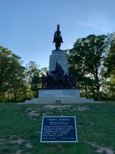 Monument which includes a statue of a man on a horse and 7 statues at the base depicting the different types of men who joined the Confederate army