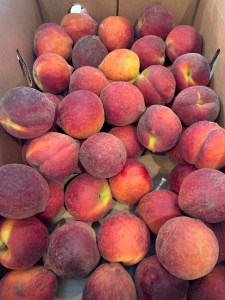 Box of whole peaches