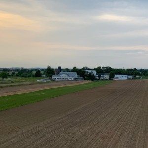 Farm with white barn